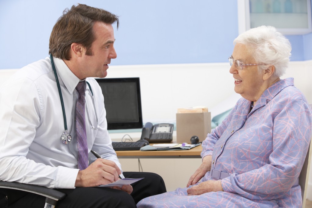 GP talking to senior woman patient